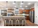 Bright kitchen with large island, stainless steel appliances, and pendant lighting at 12132 W Daley Ln, Sun City, AZ 85373