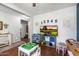 Playroom features wood floors, a TV, and colorful storage options for an organized space at 12132 W Daley Ln, Sun City, AZ 85373