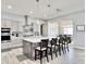 Modern kitchen with stainless steel appliances, mosaic backsplash, and a large island at 12204 W Black Hawk Rd, Casa Grande, AZ 85194