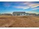 Spacious backyard with desert landscaping and a covered patio for outdoor living at 12204 W Blackhawk Rd, Casa Grande, AZ 85194