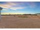 Expansive backyard featuring desert landscaping and views of neighboring properties at 12204 W Black Hawk Rd, Casa Grande, AZ 85194