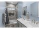 Stylish bathroom with a double sink vanity, and a shower/tub combination with tiled accents at 12204 W Black Hawk Rd, Casa Grande, AZ 85194