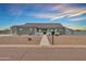 Home exterior with stone accents, desert landscaping, and a welcoming front entrance at 12204 W Blackhawk Rd, Casa Grande, AZ 85194