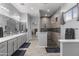 Elegant main bathroom with double vanity, decorative mirrors, and a modern, tiled shower at 12204 W Black Hawk Rd, Casa Grande, AZ 85194