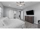 Bright and airy main bedroom featuring a sliding barn door to the en-suite bathroom at 12204 W Blackhawk Rd, Casa Grande, AZ 85194