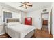 Bright bedroom featuring a neutral color palette, plush bed, and a tall red dresser at 13202 N 22Nd Ave, Phoenix, AZ 85029