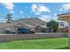 View of a home near a mountain, with a well-kept lawn and paved driveway at 13202 N 22Nd Ave, Phoenix, AZ 85029