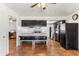 Bright, airy kitchen with black cabinets and adjacent dining area with bench seating at 13202 N 22Nd Ave, Phoenix, AZ 85029