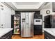 Kitchen featuring stainless steel refrigerator, built-in oven, and plenty of cabinet space at 13202 N 22Nd Ave, Phoenix, AZ 85029