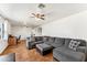 Bright living area with a large sofa, modern decor, and unique flooring at 13202 N 22Nd Ave, Phoenix, AZ 85029