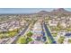 Extensive aerial view of a suburban community, showcasing diverse architecture and mountain views at 13236 N 13Th St, Phoenix, AZ 85022