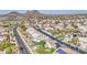 Expansive aerial view of a meticulously planned community nestled amidst mountain views at 13236 N 13Th St, Phoenix, AZ 85022