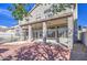 Backyard with covered patio, balcony above, and well-maintained landscaping, ideal for outdoor living and entertaining at 13236 N 13Th St, Phoenix, AZ 85022