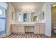 Bathroom features dual vanities, bright lighting, and a glass shower with tiled accents at 13236 N 13Th St, Phoenix, AZ 85022