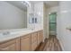 Bathroom with double sinks, wood cabinets, and tile shower is well lit at 13236 N 13Th St, Phoenix, AZ 85022