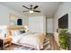 Comfortable bedroom featuring a ceiling fan, a plush rug, and a tranquil, light-filled space at 13236 N 13Th St, Phoenix, AZ 85022