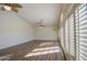 Bright and airy empty room featuring wood flooring and large windows with plantation shutters at 13236 N 13Th St, Phoenix, AZ 85022