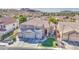 Stunning aerial view of a well-maintained two-story home with a three-car garage and desert landscaping at 13236 N 13Th St, Phoenix, AZ 85022