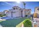 Stunning two-story home featuring a three-car garage and desert landscaping at 13236 N 13Th St, Phoenix, AZ 85022