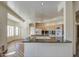 Bright kitchen features wood cabinets, a peninsula with black granite countertops and a stainless steel sink at 13236 N 13Th St, Phoenix, AZ 85022