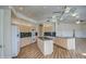 Spacious kitchen featuring an island, granite countertops, wood cabinets, and stainless steel appliances at 13236 N 13Th St, Phoenix, AZ 85022