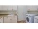 Laundry room with sink, countertops, cabinets, and washer/dryer units at 13236 N 13Th St, Phoenix, AZ 85022