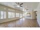 Open living room filled with natural light and views of the kitchen and exterior at 13236 N 13Th St, Phoenix, AZ 85022