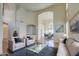 Bright living room with neutral furniture, wood floors, and an open floor plan leading to the dining area at 13236 N 13Th St, Phoenix, AZ 85022