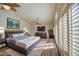 Comfortable bedroom with ample natural light, ceiling fan, and a calming color palette at 13236 N 13Th St, Phoenix, AZ 85022