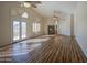 Spacious primary bedroom with a ceiling fan, vaulted ceiling, and fireplace at 13236 N 13Th St, Phoenix, AZ 85022