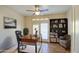 Stylish home office with dark wood desk, shelving, and comfortable seating at 13236 N 13Th St, Phoenix, AZ 85022