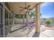 Covered patio featuring ceiling fans and views of the landscaped backyard, perfect for outdoor relaxation and entertaining at 13236 N 13Th St, Phoenix, AZ 85022