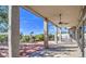 Covered patio featuring brick accents, ceiling fans, and views of the landscaped backyard, perfect for outdoor relaxation at 13236 N 13Th St, Phoenix, AZ 85022