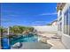 Sparkling in-ground pool featuring rock accents and lush greenery, perfect for relaxation and outdoor entertainment at 13236 N 13Th St, Phoenix, AZ 85022