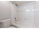 Bathroom featuring a white shower-tub combination at 16402 N 31 St # 122, Phoenix, AZ 85032