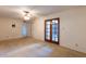 Bedroom featuring carpet, ceiling fan and wooden doors at 16402 N 31 St # 122, Phoenix, AZ 85032