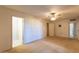 Large bedroom featuring neutral walls, a ceiling fan and carpet at 16402 N 31 St # 122, Phoenix, AZ 85032