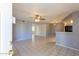 Bright living room featuring tile flooring, ceiling fan, neutral walls and open space at 16402 N 31 St # 122, Phoenix, AZ 85032