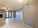 Bright living room with fireplace, French doors, and tiled floors; perfect for relaxing or entertaining at 16402 N 31 St # 122, Phoenix, AZ 85032