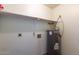 Interior shot of utility room with water heater and shelving at 16402 N 31 St # 122, Phoenix, AZ 85032