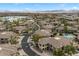 Beautiful aerial view of desert community showcasing neighborhood pool, lush landscaping, and mountain views at 16800 E El Lago Blvd # 2062, Fountain Hills, AZ 85268