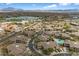 Aerial view of a planned community featuring a pool and nearby lake at 16800 E El Lago Blvd # 2062, Fountain Hills, AZ 85268