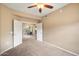 Spacious bedroom with neutral tones and ceiling fan, leading to an outdoor patio at 16800 E El Lago Blvd # 2062, Fountain Hills, AZ 85268