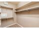 Walk-in closet featuring carpet flooring, multiple shelves and hanging rods at 16800 E El Lago Blvd # 2062, Fountain Hills, AZ 85268