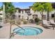 Relaxing community hot tub surrounded by greenery and lounge chairs for ultimate relaxation at 16800 E El Lago Blvd # 2062, Fountain Hills, AZ 85268