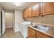 Functional laundry room with ample cabinet space and a utility sink at 16800 E El Lago Blvd # 2062, Fountain Hills, AZ 85268