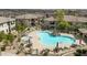 Aerial view of the community pool with lounge chairs and manicured landscaping at 16800 E El Lago Blvd # 2062, Fountain Hills, AZ 85268