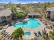 Inviting community pool area with ample seating, lush landscaping, and a covered lounge, perfect for relaxation at 16800 E El Lago Blvd # 2062, Fountain Hills, AZ 85268