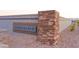 Community sign, 'Ryder Ranch', constructed of stone, wood, and metal at 17165 W Corrine Dr, Surprise, AZ 85388