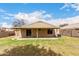 A view of a spacious backyard with a covered patio, perfect for relaxing outdoors at 1753 E Pinto Dr, Gilbert, AZ 85296